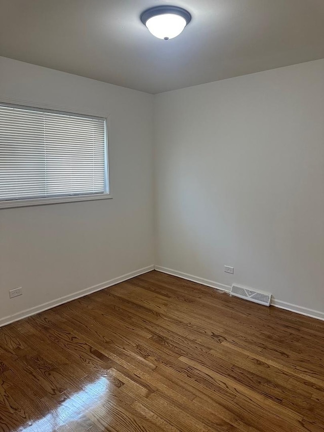 16341 Justine St, Markham, IL 60428 - spare room with dark wood finished floors and baseboards