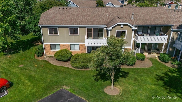 390 Thornhill Ct Unit D2, Schaumburg, IL 60193 - view of front of property featuring brick siding, a front yard, and roof with shingles