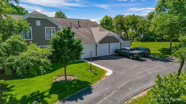 390 Thornhill Ct Unit D2, Schaumburg, IL 60193 - view of front facade featuring an attached garage, asphalt driveway, and a front lawn