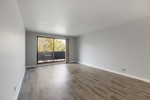 898 Wellington Ave Unit 218, Elk Grove Village, IL 60007 - spare room with wood finished floors and baseboards