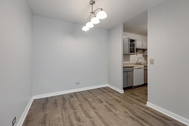 898 Wellington Ave Unit 218, Elk Grove Village, IL 60007 - unfurnished dining area with wood finished floors and a sink
