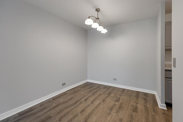 898 Wellington Ave Unit 218, Elk Grove Village, IL 60007 - unfurnished room featuring dark wood-style flooring and baseboards