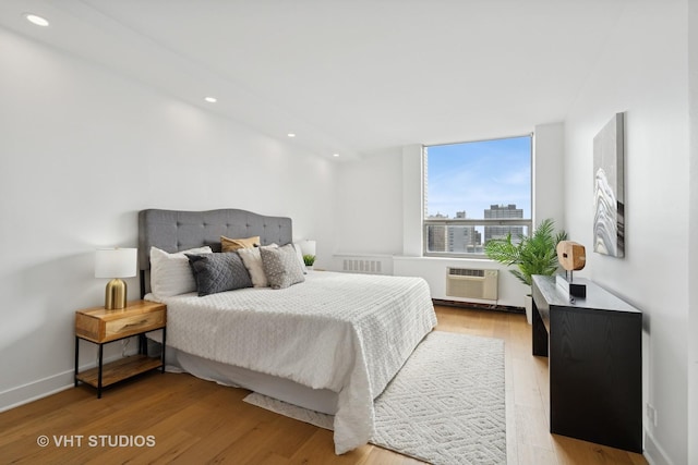 1455 N Sandburg Ter Unit 2606, Chicago, IL 60610 - bedroom featuring light wood-style flooring, recessed lighting, and a view of city