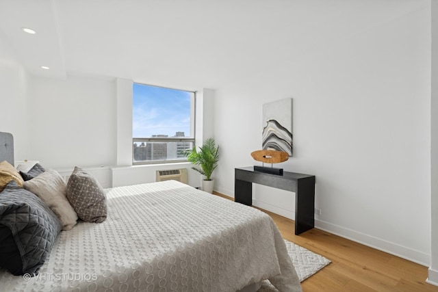 1455 N Sandburg Ter Unit 2606, Chicago, IL 60610 - bedroom with light wood-style flooring, recessed lighting, and a wall unit AC