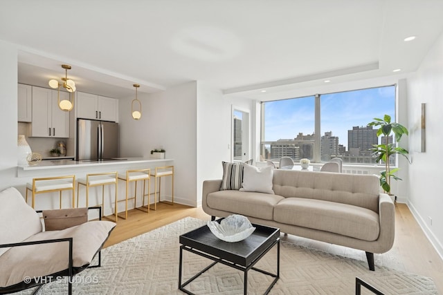 1455 N Sandburg Ter Unit 2606, Chicago, IL 60610 - living area with light wood-style flooring, a view of city, and recessed lighting