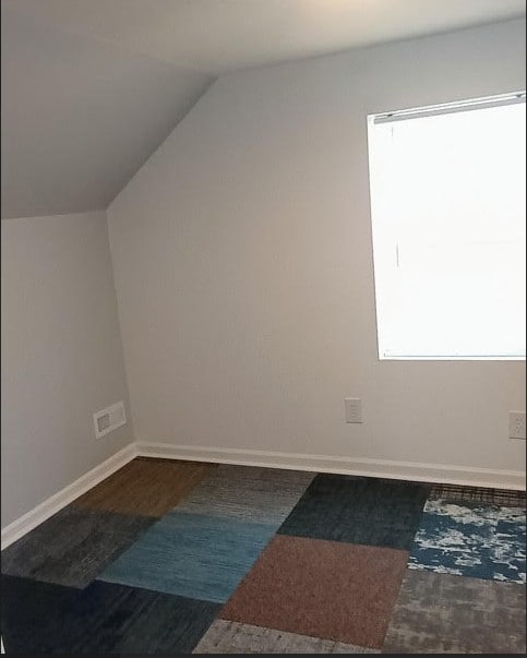 6084 S 75th Ave, Summit, IL 60501 - additional living space with vaulted ceiling and wood finished floors