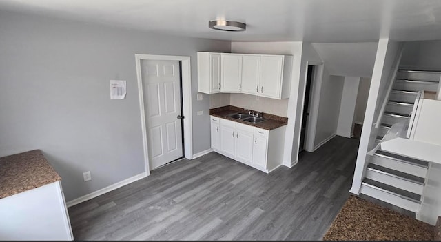 6084 S 75th Ave, Summit, IL 60501 - kitchen featuring dark wood-type flooring, white cabinets, and dark countertops