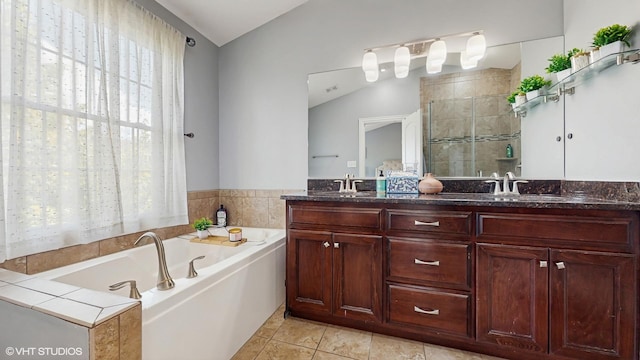17958 Fountain Cir, Orland Park, IL 60467 - full bathroom with vaulted ceiling, double vanity, a garden tub, a stall shower, and tile patterned flooring