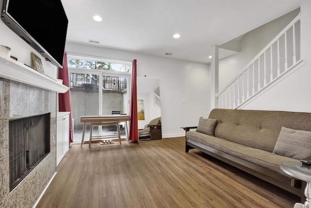 1428 W Lexington St Unit 1, Chicago, IL 60607 - living room with wood finished floors, a fireplace, stairs, and recessed lighting