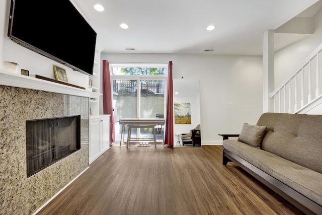 1428 W Lexington St Unit 1, Chicago, IL 60607 - living area with wood finished floors, recessed lighting, stairs, and a fireplace