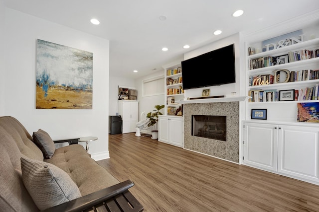 1428 W Lexington St Unit 1, Chicago, IL 60607 - living room with light wood-style floors, a fireplace, recessed lighting, and built in features