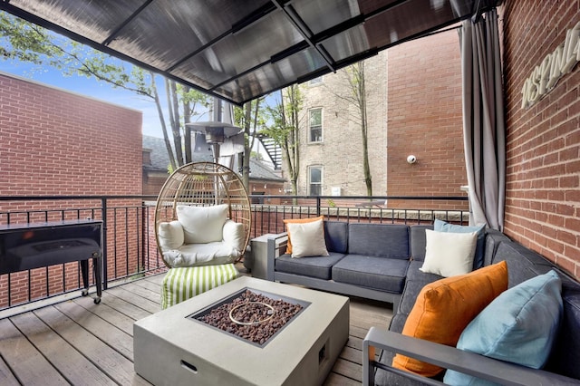 1428 W Lexington St Unit 1, Chicago, IL 60607 - wooden terrace featuring an outdoor living space with a fire pit