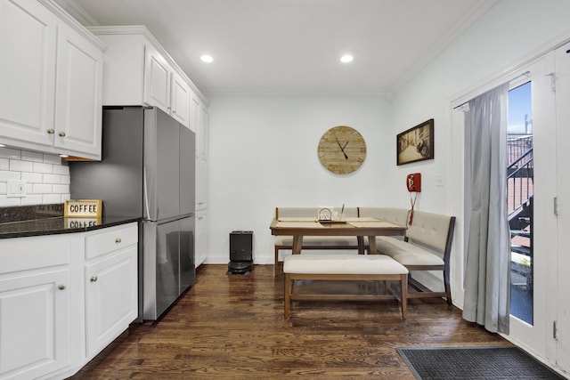 1428 W Lexington St Unit 1, Chicago, IL 60607 - kitchen with crown molding, freestanding refrigerator, tasteful backsplash, white cabinets, and dark wood-style floors