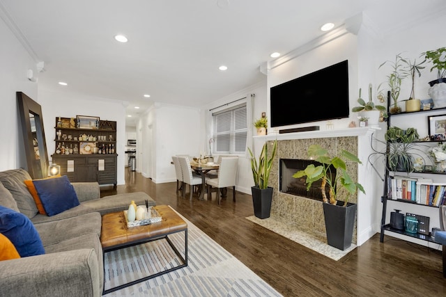 1428 W Lexington St Unit 1, Chicago, IL 60607 - living area with ornamental molding, wood finished floors, a fireplace with flush hearth, and recessed lighting