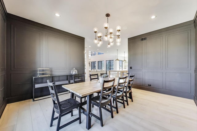 16226 Syd Creek Dr, Homer Glen, IL 60491 - dining area featuring a decorative wall, a chandelier, recessed lighting, and light wood-style floors