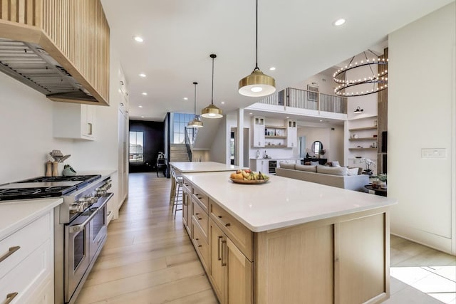 16226 Syd Creek Dr, Homer Glen, IL 60491 - kitchen with range with two ovens, range hood, open floor plan, a center island, and light countertops