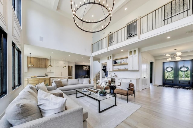 16226 Syd Creek Dr, Homer Glen, IL 60491 - living area with a chandelier, light wood-type flooring, a high ceiling, beverage cooler, and recessed lighting