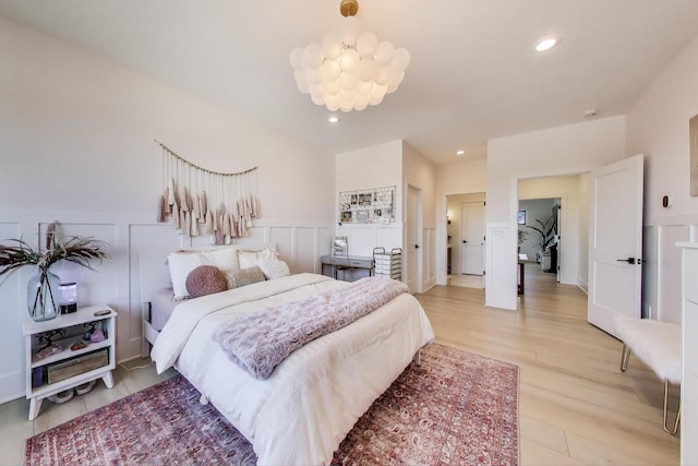 16226 Syd Creek Dr, Homer Glen, IL 60491 - bedroom with wainscoting, light wood-type flooring, recessed lighting, and a decorative wall