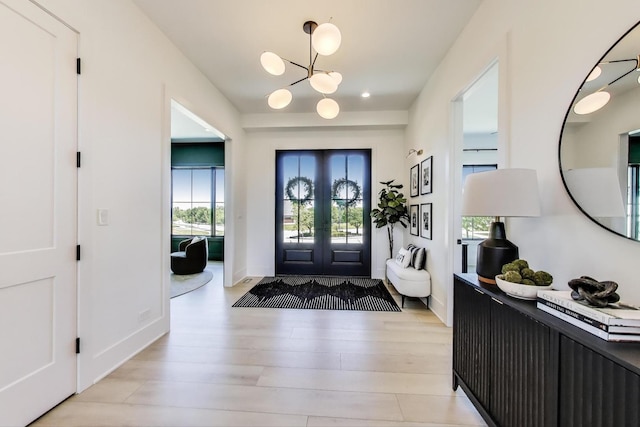 16226 Syd Creek Dr, Homer Glen, IL 60491 - entryway with light wood-style floors, a chandelier, and french doors