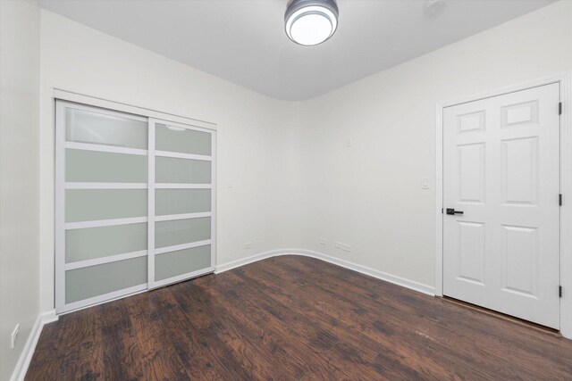 4734 S Saint Lawrence Ave Unit 1N, Chicago, IL 60615 - spare room featuring wood finished floors and baseboards