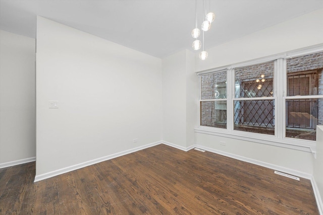 4734 S Saint Lawrence Ave Unit 1N, Chicago, IL 60615 - empty room with baseboards and dark wood-style flooring
