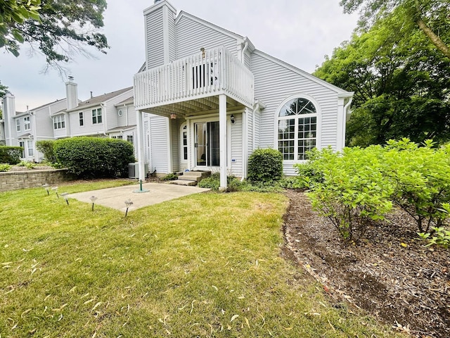 4797 Amber Cir, Hoffman Estates, IL 60192 - rear view of property with a balcony, a lawn, a chimney, and a patio area