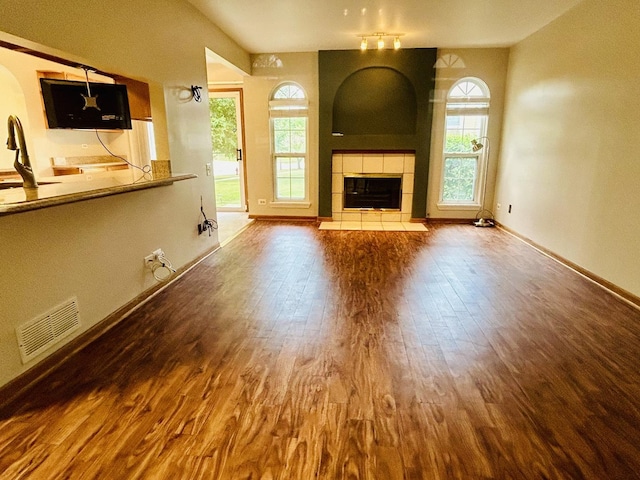 4797 Amber Cir, Hoffman Estates, IL 60192 - unfurnished living room with wood finished floors and a fireplace