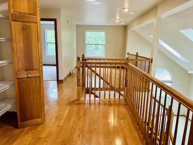 4797 Amber Cir, Hoffman Estates, IL 60192 - corridor featuring an upstairs landing, a skylight, light wood finished floors, and recessed lighting