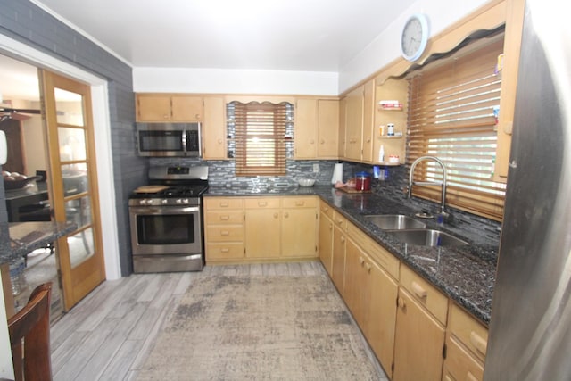 1005 Black Rd, Joliet, IL 60435 - kitchen with appliances with stainless steel finishes, light wood-type flooring, tasteful backsplash, light brown cabinets, and dark stone countertops