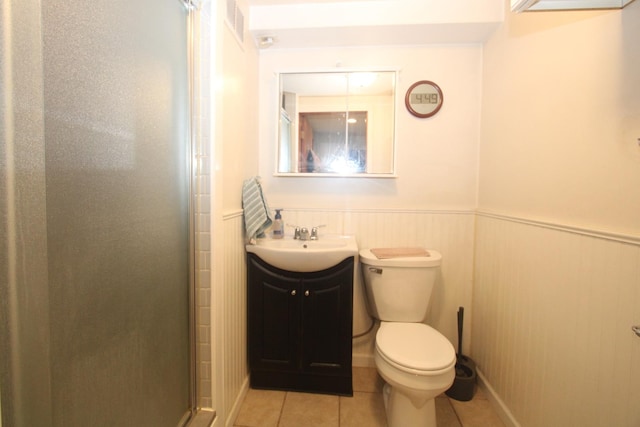 1005 Black Rd, Joliet, IL 60435 - bathroom featuring a stall shower, vanity, tile patterned flooring, and a wainscoted wall