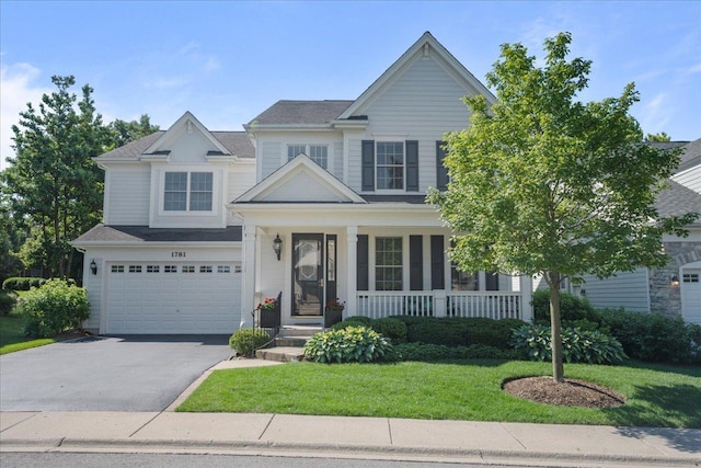1781 Aberdeen Dr, Glenview, IL 60025 - view of front of home with driveway, a front lawn, covered porch, and a garage