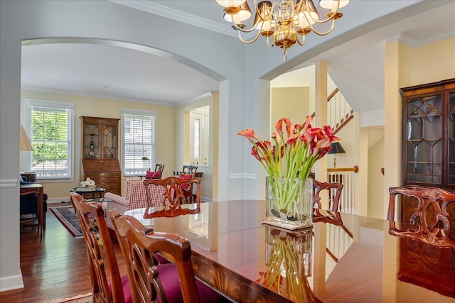 1781 Aberdeen Dr, Glenview, IL 60025 - dining area with arched walkways, crown molding, wood finished floors, and a chandelier