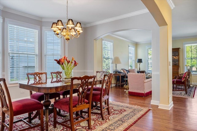1781 Aberdeen Dr, Glenview, IL 60025 - dining area with arched walkways, wood finished floors, a chandelier, and ornamental molding