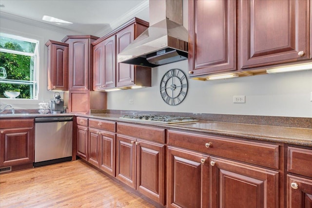 1781 Aberdeen Dr, Glenview, IL 60025 - kitchen featuring appliances with stainless steel finishes, wall chimney exhaust hood, ornamental molding, light wood-style flooring, and dark countertops