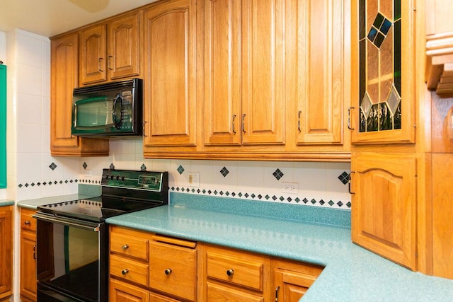 3427 Vollmer Rd Unit 209, Flossmoor, IL 60422 - kitchen with black appliances, backsplash, brown cabinetry, and light countertops