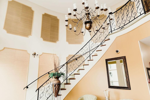 3427 Vollmer Rd Unit 209, Flossmoor, IL 60422 - stairs featuring a towering ceiling, a chandelier, and crown molding