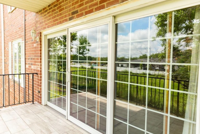 3427 Vollmer Rd Unit 209, Flossmoor, IL 60422 - doorway featuring brick wall and healthy amount of natural light