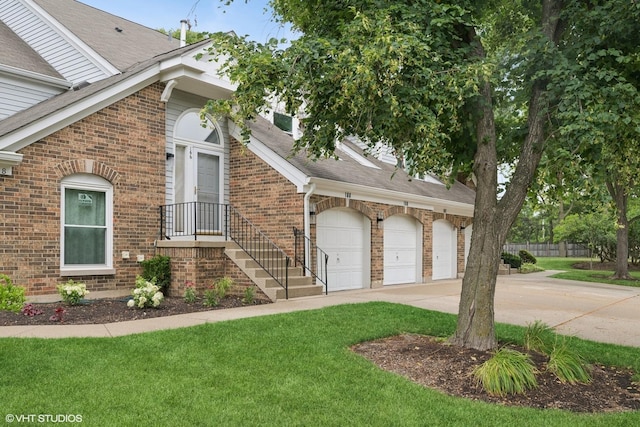 166 Willow Pkwy Unit 166, Buffalo Grove, IL 60089 - view of property exterior featuring driveway, brick siding, an attached garage, and roof with shingles
