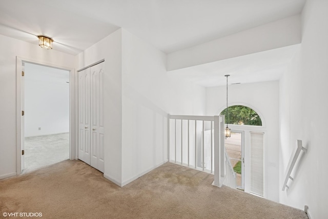 166 Willow Pkwy Unit 166, Buffalo Grove, IL 60089 - corridor featuring carpet floors, an upstairs landing, and a chandelier
