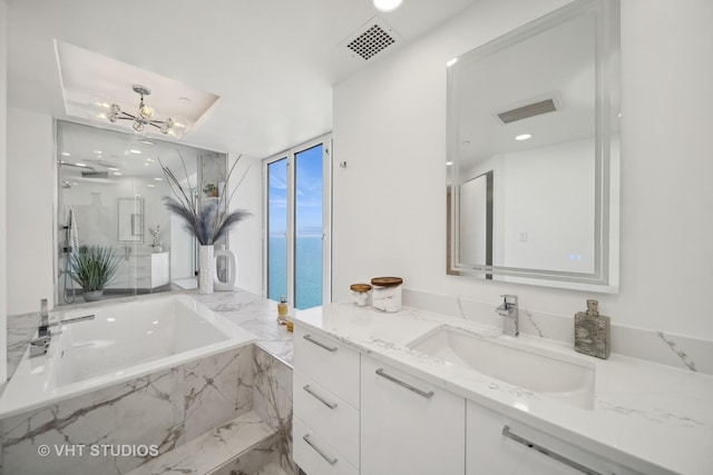 950 N Michigan Ave Unit 4904, Chicago, IL 60611 - full bathroom featuring vanity, a bath, a chandelier, and recessed lighting