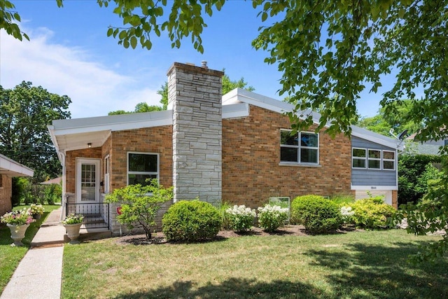 8844 Laramie Ave, Skokie, IL 60077 - view of front of property featuring a front lawn, brick siding, and a chimney