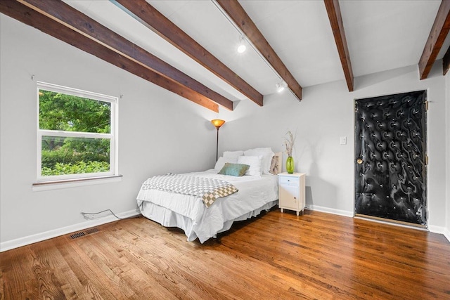 8844 Laramie Ave, Skokie, IL 60077 - bedroom featuring beamed ceiling and wood finished floors