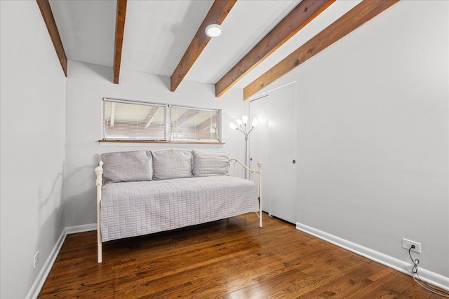 8844 Laramie Ave, Skokie, IL 60077 - bedroom with beamed ceiling, a closet, and wood finished floors