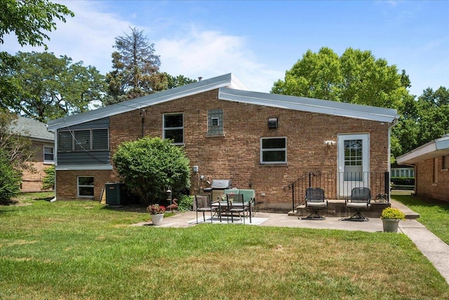 8844 Laramie Ave, Skokie, IL 60077 - rear view of house featuring a patio, a yard, and brick siding