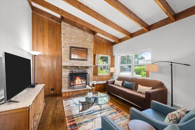 8844 Laramie Ave, Skokie, IL 60077 - living area with dark wood-type flooring, beamed ceiling, a stone fireplace, high vaulted ceiling, and wooden walls