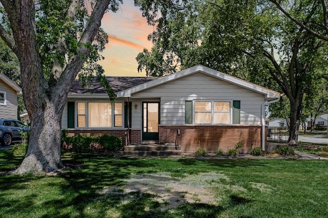521 Michael Ave, Crete, IL 60417 - view of front facade with brick siding and a front yard