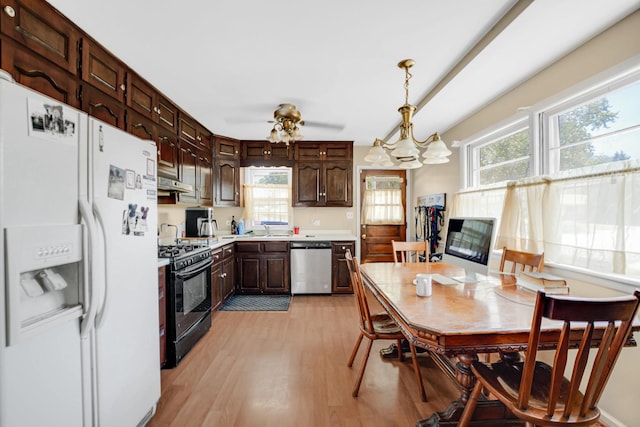 521 Michael Ave, Crete, IL 60417 - kitchen with white fridge with ice dispenser, dishwasher, black gas stove, light wood-style flooring, and light countertops