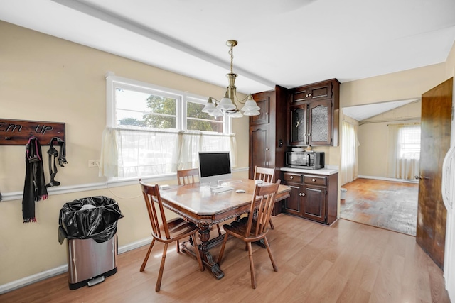 521 Michael Ave, Crete, IL 60417 - dining room with light wood-style flooring, a chandelier, and lofted ceiling