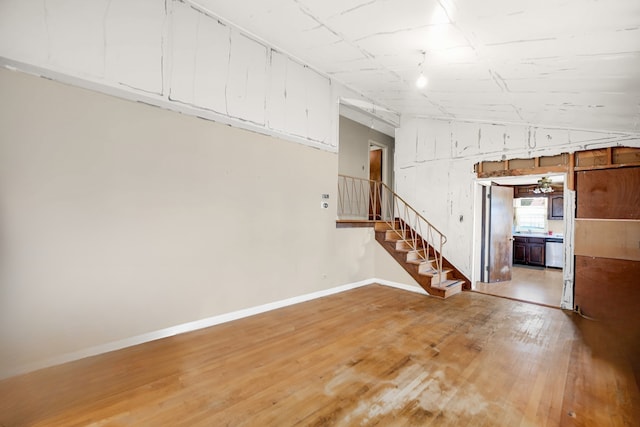 521 Michael Ave, Crete, IL 60417 - below grade area with light wood-style floors and stairs