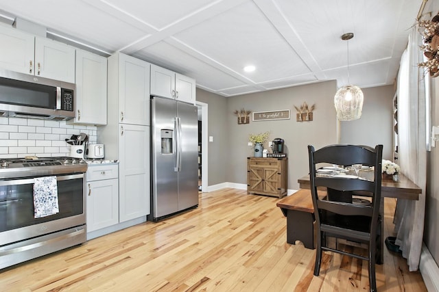 40474 N Glendale Ave, Beach Park, IL 60099 - kitchen featuring stainless steel appliances, light wood-style flooring, tasteful backsplash, hanging light fixtures, and light countertops